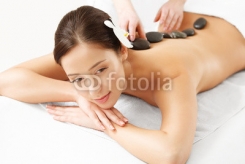 Stone_Massage._Beautiful_Woman_Getting_Spa_Hot_Stones_Massage.jpg